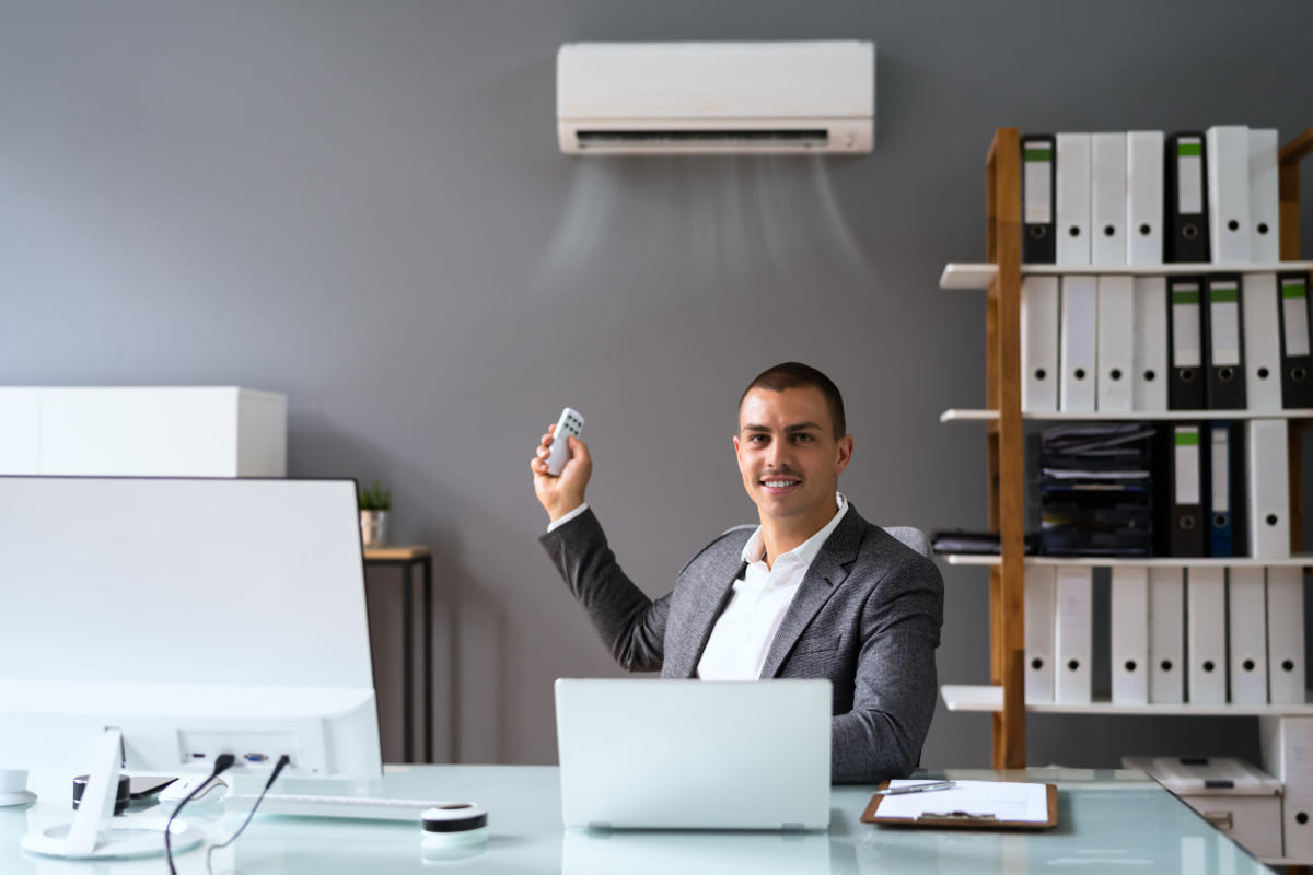 Businessman working in office with air conditioning